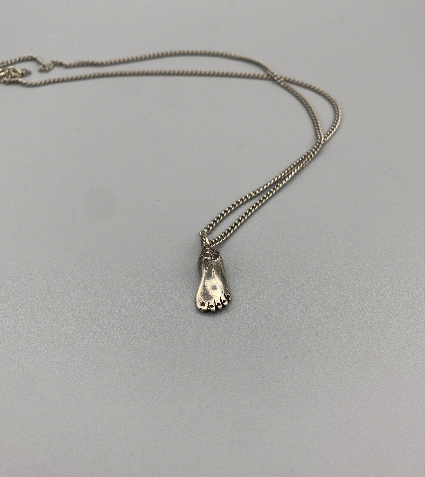 lost foot necklace